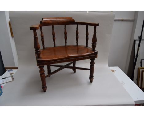A William III oak judges chair with x-stretcher and turned legs, later raised on ceramic casters