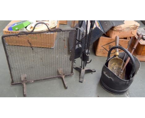 A small coal scuttle with brass coal shovel with turned wooden handle, a toasting fork, a poker, a four piece set of fire too