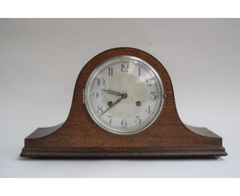 A wooden mantel clock with Arabic numerals to silvered chapter ring, with a ceramic clock in the shape of two owls