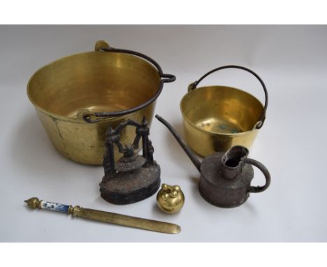 Two heavy gauge brass pots with handles, the one 12", the other 8", along with a brass letter opener with blue and white cera