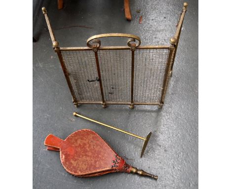 A set of wood and red leather bellows, the end in brass, 50cmL, with a three panel folding brass fire screen, 50cmH, and a br