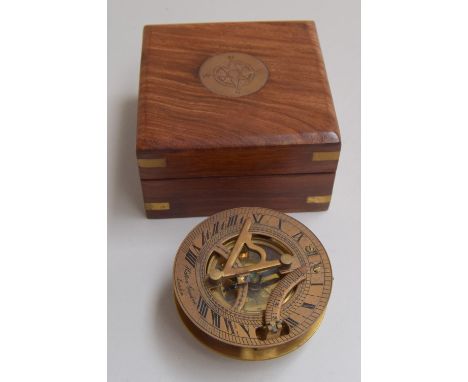 Maritime interest: a brass nautical sundial and compass inscribed 'Hatton Garden, London', in a fitted mahogany box with bras