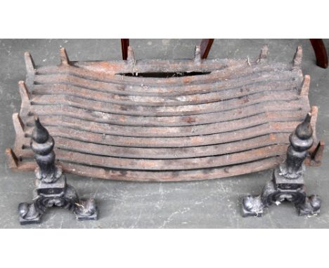 An unusually wide cast iron fire grate, resting on two fire dogs, 38x76.5cm wide