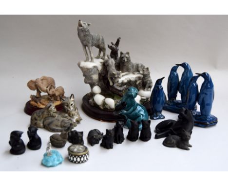 Three trays of animal figurines, including wolves, donkeys, elephants, coal cats, blue ceramic penguins, and others