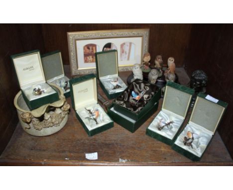 SECTION 48. A collection of seven boxed Albany ceramic birds and six Royal Doulton owls on fitted wooden stand, together with