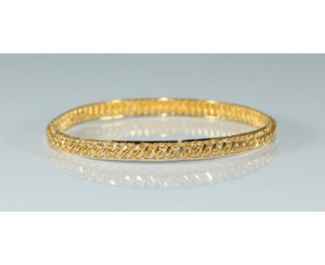 A 21k gold bangle of of stylise rope-twist design, 14.58g 