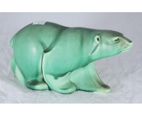 A Spode's Royal Jade pottery figure of a polar bear, with black printed mark to base and impressed number 'K447.' 32cm long 