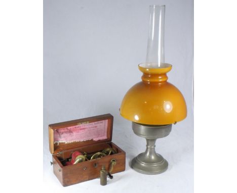 A 'Magneto-Electric Machine (AF) together with a paraffin lamp with opaque shade 