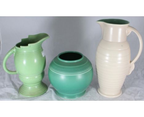 Three assorted pottery items comprising a Royal Cauldon jug, 21cm high, a Weatherby 'Falcon Ware' pottery jug, 27cm high and 