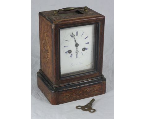 A stained and inlaid silk suspension mantel clock, the white dial with Roman numerals denoting hours and marked 'Cans a' Pari
