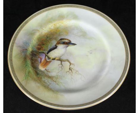 A Royal Worcester cabinet plate plainted with a Kookaburra perched on a branch, signed R. Austin, 22cm diameter, puce Worcest