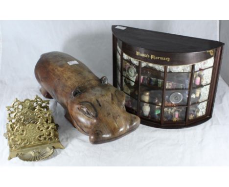 A miniature Victorian 'style' display window for Plumb’s Pharmacy, with various drug jars, scales and mortars etc, together w