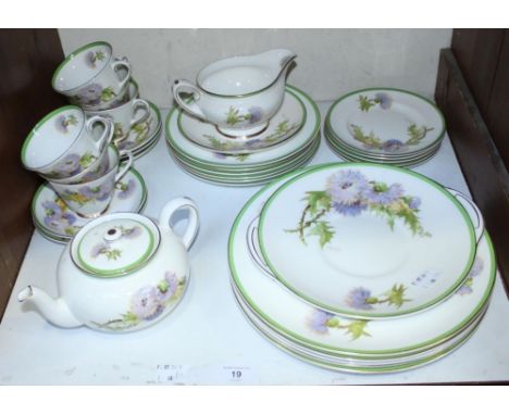 SECTION 19. A 31-piece Royal Doulton 'Glamis Thistle' pattern part tea and dinner service, signed 'P. Curnock'. 