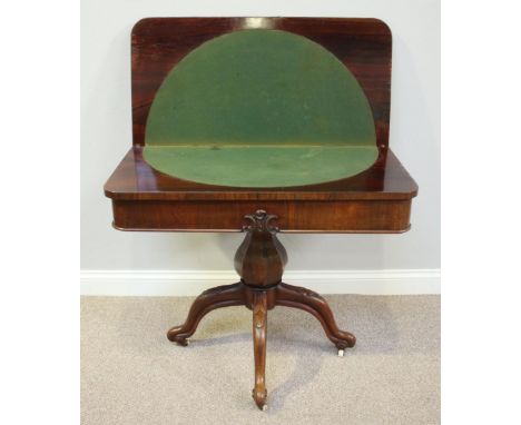 A Victorian rosewood folding card table, the top lifting to reveal a green playing baize and raised on a shaped octagonal col