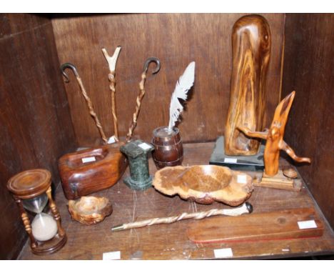SECTION 55. An assortment of mixed wooden items including  four carved miniature walking sticks, a sculpture on pedestal base