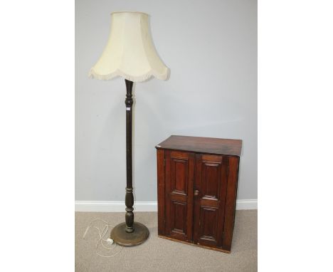 A small stained mahogany two door cabinet, 64cm wide, together with a stained standard lamp with white shade 