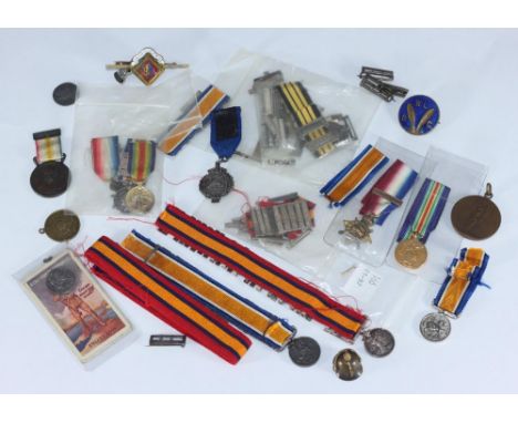A small quantity of Boer War and WW1 miniature medals with numerous battle clasps, together with a miniature pickelhaube helm