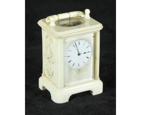 An unusual 19th century ivory cased miniature carriage clock, the white enamel dial with Roman numerals denoting hours and ex