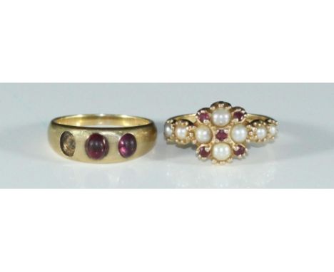 A 14ct gold seed pearl and ruby ring, 3.98g, together with an 18ct gold and amethyst ring (one stone missing), 5.33g (2) 