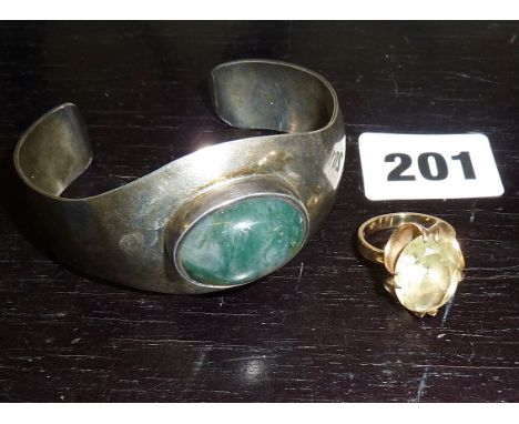 Modernist jewellery, a silver cuff bracelet by K.J. Otteren of Norway, with green stone cabochon, and a 9ct gold 1960s dress 