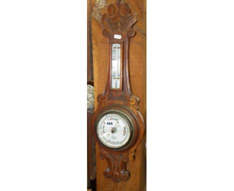 Oak carved aneroid barometer marked as by Benn Franks Optician (glass cracked)