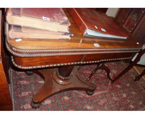 19th c. rosewood foldover card table with centre column above platform base