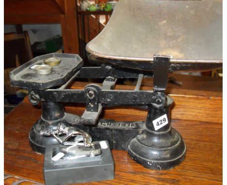 Cast iron shop scales and a chrome "car mascot" in the form of a devil
