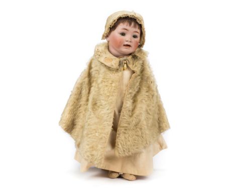 *Doll. A bisque head doll, Continental, circa 1910,  composition character doll with articulated limbs, bisque head impressed