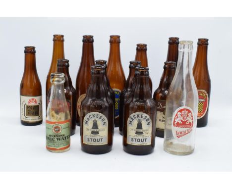 A collection of vintage 20th century beer bottles (mainly brown) to include makes such as Mackeson Stout, Thwaites, Wilson's 