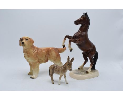 A collection of pottery to include a Beswick donkey foal 2110, a Hertwig rearing horse and an unmarked (Sylvac/Coopercraft?) 