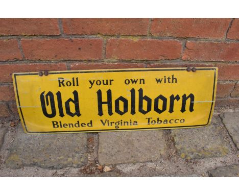 A vintage 20th century advertising sign 'Roll your own with Old Holburn Blended Virginia Tobacco'. 61 x 20cm. With age relate