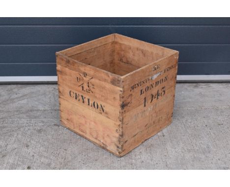A vintage wooden advertising crate with 'Ceylon' and 'London' marked onto the sides amongst other information. In good condit