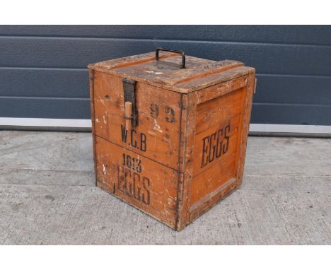 A vintage 20th century wooden egg crate with either 'WCB' or 'WGB' with 'EGGS' on each side and a box/ stock number. Great st