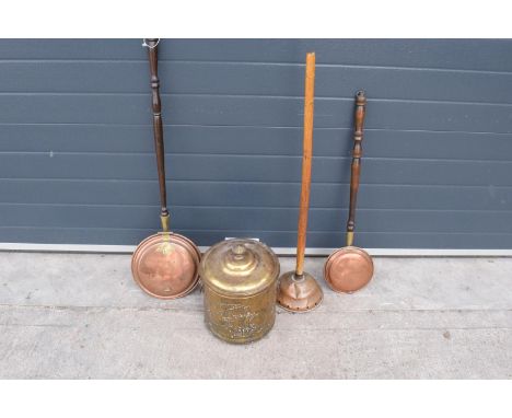 A collection of metal ware to include a brass coal bucket, 2 copper bed pans and a similar item (4). 