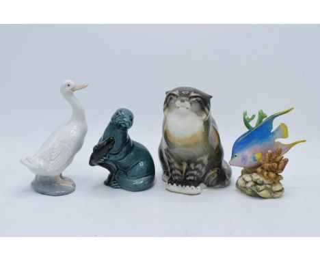 A collection of pottery to include a USSR Cat 2003, Poole pottery Otter, Nao duck and a Royal Worcester Blue Angel 3574 (4). 