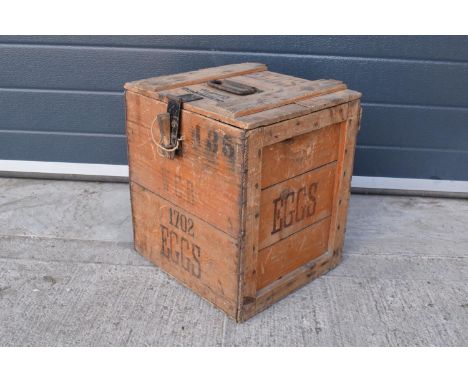 A vintage 20th century wooden egg crate with either 'WCB' or 'WGB' with 'EGGS' on each side and a box/ stock number. Great st