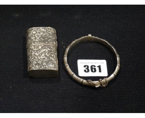     A Silver Bangle Together With A Silver Covered Lighter                          