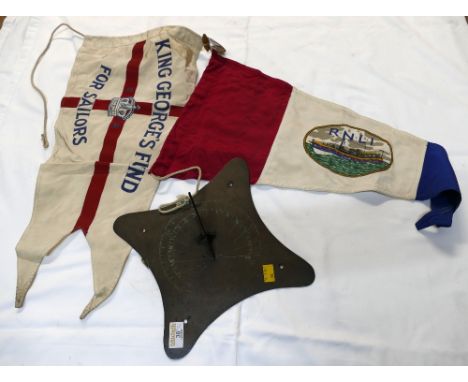 Brass sundial and two flags, King Georges Fund For Sailors and RNLI