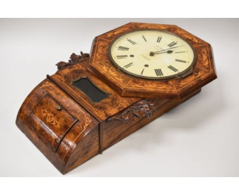 A WALNUT ENCASED EIGHT DAY PENDULUM WALL CLOCK with marquetry decoration and carved oak laurel mounts, the dial of octagonal 