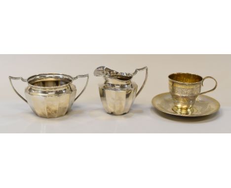STERLING / CONTINENTAL SILVER comprising matching fluted sugar basin and cream jug, together with an en engraved cup and sauc