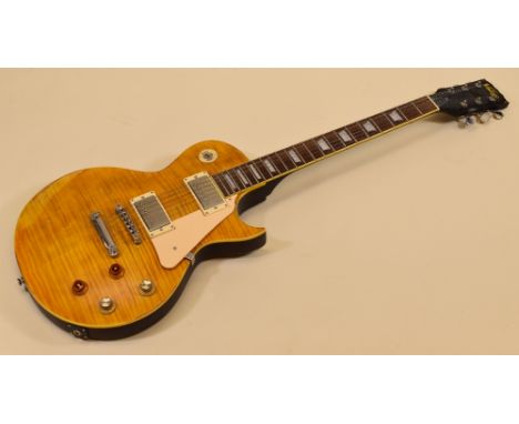 A VINTAGE ELECTRIC GUITAR in light wood with dark wood contrast, serial number I06101330, 100cms long