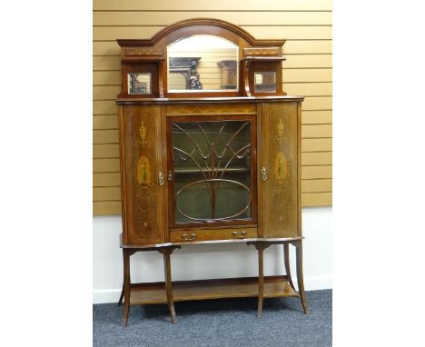 A CABINET SIDEBOARD composed of centre glazed door flanked by a pair of bowed cupboards and with centre base drawer all raise