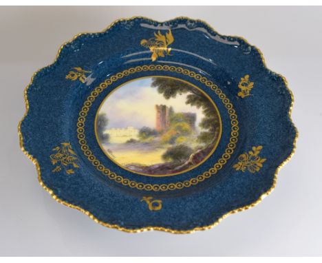 A ROYAL WORCESTER CAKE STAND having a circular painted landscape scene of 'Cardiff Castle' signed G H Evans, the border of pe
