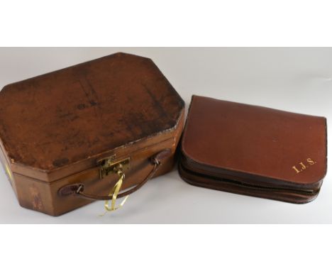 TWO LEATHER CASED VANITY SETS one being of lockable box form with monogram to lid and complete with a set of nine pink guillo