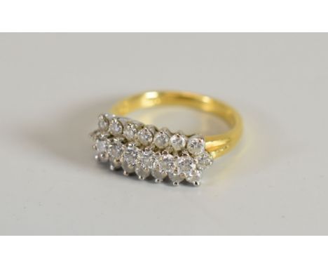 AN 18CT YELLOW GOLD & DIAMOND CLUSTER RING of twenty-two diamonds in three rows, 4.5gms