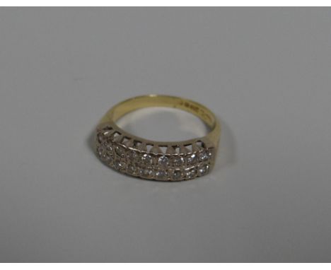 AN 18CT YELLOW GOLD HALF HOOP DIAMOND ETERNITY RING having two rows of nine diamonds each, total visual estimate 0.35cts, 4.8