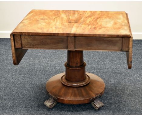 WILLIAM IV MAHOGANY DROP FLAP SOFA-TABLE having a substantial circular and columnal base with four carved supports