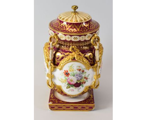 AN ENGLISH PORCELAIN ICE PAIL the body profusely gilded to a monarch-red reserve and having four raised cruciform panels with