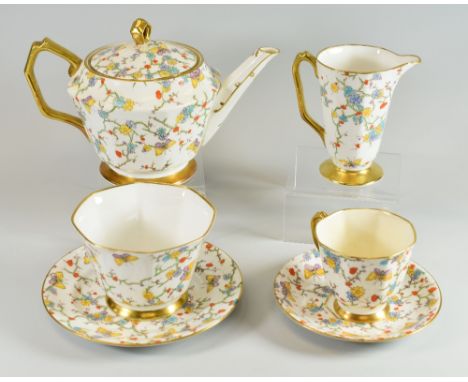 A ROYAL STAFFORD BONE CHINA BREAKFAST-SET with pretty floral and butterfly decoration and having gilded handles and feet PLEA