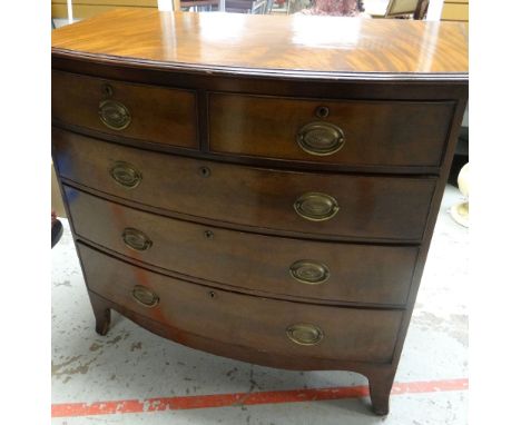 A BOW FRONT MAHOGANY CHEST of three long and two short drawers